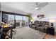 Spacious living room with ceiling fan, lamps, and ocean view at 5511 N Ocean Blvd. # 902, Myrtle Beach, SC 29577