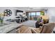 Spacious living room with dining area, a ceiling fan, and a ocean view at 5511 N Ocean Blvd. # 902, Myrtle Beach, SC 29577