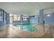 Indoor pool with a clear view of the outside through the glass doors at 5511 N Ocean Blvd. # 902, Myrtle Beach, SC 29577