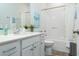 Bright bathroom with white vanity, mirror, toilet, and shower-tub with curtain at 640 Mccorkle Place, Conway, SC 29526