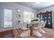 Dining area boasts stylish decor, with seating for six, a colorful rug and bright light at 640 Mccorkle Place, Conway, SC 29526