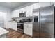 Kitchen with stainless steel appliances, white cabinets, and granite countertops at 640 Mccorkle Place, Conway, SC 29526