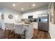 Kitchen island with seating and stainless steel appliances, white cabinets, and granite countertops at 640 Mccorkle Place, Conway, SC 29526