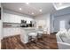 Kitchen island with seating and stainless steel appliances, white cabinets, and granite countertops at 640 Mccorkle Place, Conway, SC 29526