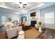 Cozy living room with fireplace, ceiling fan, and lots of natural light at 640 Mccorkle Place, Conway, SC 29526