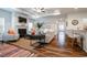 Open-concept living room flows into the kitchen, showcasing hardwood floors and a fireplace at 640 Mccorkle Place, Conway, SC 29526