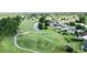 Aerial view of the community golf course, water feature, and nearby homes at 697 Tupelo Ln. # 24G, Longs, SC 29568