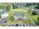 Aerial view of an apartment building with a golf course in the background at 697 Tupelo Ln. # 24G, Longs, SC 29568