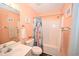 Bathroom featuring a vanity sink, toilet, and shower with a vibrant floral shower curtain at 697 Tupelo Ln. # 24G, Longs, SC 29568