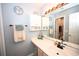 Functional bathroom features double vanity, large mirror, and ample storage cabinets at 697 Tupelo Ln. # 24G, Longs, SC 29568