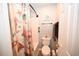 Stylish bathroom features a shower-tub combination with coastal-themed decor at 697 Tupelo Ln. # 24G, Longs, SC 29568