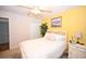 Bright bedroom with white bedding, closet, ceiling fan, and a painting, creating a cozy and inviting atmosphere at 697 Tupelo Ln. # 24G, Longs, SC 29568