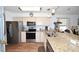 Well-equipped kitchen with stainless steel appliances, granite counters, and open access to the living area at 697 Tupelo Ln. # 24G, Longs, SC 29568