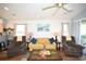 Bright living room with stylish furniture, golf course views, and seamless connection to the kitchen at 697 Tupelo Ln. # 24G, Longs, SC 29568