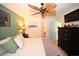 Serene main bedroom with a leaf-design ceiling fan, en-suite bathroom access, and a wall-mounted television at 697 Tupelo Ln. # 24G, Longs, SC 29568