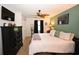Inviting main bedroom showcases a king bed, mounted TV, and a black dresser for ample storage at 697 Tupelo Ln. # 24G, Longs, SC 29568
