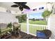 Relaxing screened patio with golf course views, comfortable seating, and ceiling fan at 697 Tupelo Ln. # 24G, Longs, SC 29568