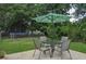 Backyard with patio area featuring outdoor seating and an umbrella at 728 Tarpon Ct., Myrtle Beach, SC 29579
