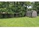 The spacious backyard has a barn-style storage shed with a swing set at 728 Tarpon Ct., Myrtle Beach, SC 29579
