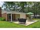 Spacious backyard with patio, outdoor seating, grill, and lush landscaping at 728 Tarpon Ct., Myrtle Beach, SC 29579