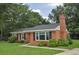 Charming brick home with a well-maintained lawn and mature trees at 728 Tarpon Ct., Myrtle Beach, SC 29579