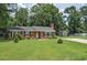 Quaint brick home on a large lot with mature trees and a shed in the backyard at 728 Tarpon Ct., Myrtle Beach, SC 29579