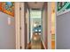 Hallway view showcases the hardwood floors and accent furniture in the living room at 728 Tarpon Ct., Myrtle Beach, SC 29579