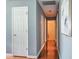 Bright hallway with hardwood floors and neutral paint throughout at 728 Tarpon Ct., Myrtle Beach, SC 29579