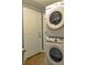 Convenient laundry room featuring a stackable washer and dryer, and access to the outside at 728 Tarpon Ct., Myrtle Beach, SC 29579