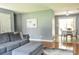 Spacious living room with a comfortable gray sofa and an adjacent dining area at 728 Tarpon Ct., Myrtle Beach, SC 29579
