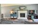 Spacious living room with fireplace, shelving, and comfortable seating arrangement at 728 Tarpon Ct., Myrtle Beach, SC 29579