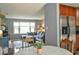 Open concept view from dining area into the living room with a large sofa at 728 Tarpon Ct., Myrtle Beach, SC 29579