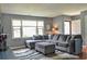 Comfortable living room featuring a large sectional sofa and plenty of natural light at 728 Tarpon Ct., Myrtle Beach, SC 29579