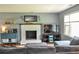 Cozy living room features a painted brick fireplace and comfortable gray sofa at 728 Tarpon Ct., Myrtle Beach, SC 29579