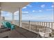 Balcony with ocean views, outdoor seating, and white railings at 817 S Ocean Blvd. # 201, North Myrtle Beach, SC 29582