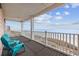 Inviting balcony with blue chairs showcases stunning ocean views, perfect for relaxing at 817 S Ocean Blvd. # 201, North Myrtle Beach, SC 29582