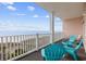 Balcony with ocean views and blue chairs at 817 S Ocean Blvd. # 201, North Myrtle Beach, SC 29582