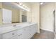 Spacious bathroom featuring double vanity, large mirrors, and white cabinetry in a light-filled space at 817 S Ocean Blvd. # 201, North Myrtle Beach, SC 29582
