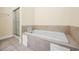 Relaxing bathroom featuring a soaking tub with tile surround and glass door shower at 817 S Ocean Blvd. # 201, North Myrtle Beach, SC 29582