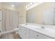 Well-lit bathroom featuring a double vanity, tile floors, and a shower/tub combination at 817 S Ocean Blvd. # 201, North Myrtle Beach, SC 29582