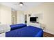Bedroom featuring twin beds and a television on a wicker chest of drawers at 817 S Ocean Blvd. # 201, North Myrtle Beach, SC 29582
