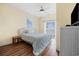 Bright bedroom features twin bed, wood floors, and natural light, showcasing peaceful retreat at 817 S Ocean Blvd. # 201, North Myrtle Beach, SC 29582