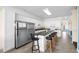 Well-equipped kitchen with stainless steel appliances, white cabinets, and granite countertop island at 817 S Ocean Blvd. # 201, North Myrtle Beach, SC 29582