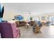Spacious living room featuring tile floors, comfortable seating, and scenic views of the ocean at 817 S Ocean Blvd. # 201, North Myrtle Beach, SC 29582