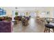 Open-concept living and dining area with tile flooring, ocean views, and comfortable seating arrangements at 817 S Ocean Blvd. # 201, North Myrtle Beach, SC 29582