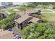 Aerial view of Mariners Cove condos nestled among mature trees, with parking and waterway in background at 9501 Shore Dr. # B-224, Myrtle Beach, SC 29572