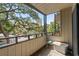 Balcony with metal railing offers tree-lined and parking lot views in a nice setting at 9501 Shore Dr. # B-224, Myrtle Beach, SC 29572