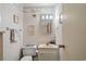 Cozy bathroom with patterned wallpaper, a vanity, and essential fixtures at 9501 Shore Dr. # B-224, Myrtle Beach, SC 29572