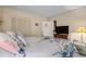 Cozy bedroom featuring a large closet, dresser with TV, and a beach themed comforter at 9501 Shore Dr. # B-224, Myrtle Beach, SC 29572