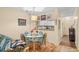 Dining room with seating for four and an open view to the kitchen at 9501 Shore Dr. # B-224, Myrtle Beach, SC 29572